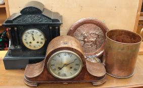 A black slate mantle clock together with an oak clock, copper dish,