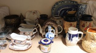 A Chinese blue and white charger together with blue and white pottery and porcelain, sauce tureens,