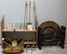 An Indian brass table top and folding base together with brass fire irons,