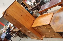 A modern pine wardrobe together with a chest of drawers