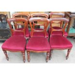 A set of six Victorian mahogany dining chairs with a pad seat on turned tapering legs