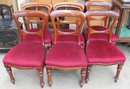 A set of six Victorian mahogany dining chairs with a pad seat on turned tapering legs