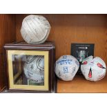 A Cardiff City Football Club signed football together with three other signed footballs and a