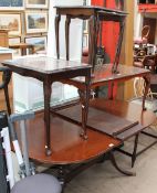 A reproduction mahogany extending dining table together with a coffee and three occasional tables