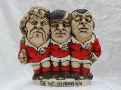 A John Hughes pottery Grogg, The Welsh Front Row, depicting Price, Windsor & Faulkner,