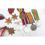 Three World War I medals including the War Medal, Victory Medal and 1914-15 Star,