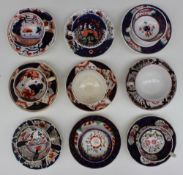 A collection of Gaudy welsh teacups and saucers various patterns including Cherry Tree,