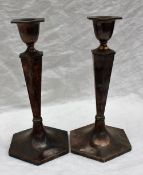 A pair of George VI silver candlesticks, of hexagonal tapering form on a spreading foot, Sheffield,