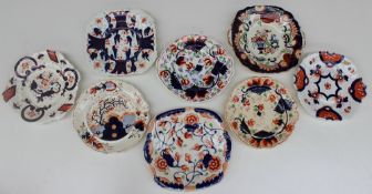 A collection of Gaudy Welsh bread and butter plates, various patterns including grapes, hexagon,