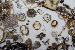 A cameo brooch, together with assorted costume jewellery including brooches, necklaces,