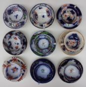 A collection of Gaudy welsh tea cups and saucers, various patterns including Llandaff, Abutilon,