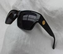 A pair of Versace model 372,