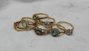 A 9ct yellow gold citrine set ring together with a collection of 9ct gold semi precious set rings