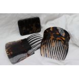 A pair of faux tortoiseshell hair combs,