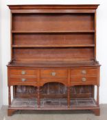 A 19th century South Wales oak dresser, with a moulded cornice, with two shelves,