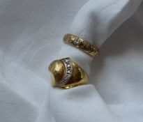 An 18ct yellow gold ring set with graduated round brilliant cut diamonds approximately 7 grams