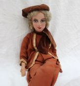 A French Boudoir doll, with a cloth head, painted features,