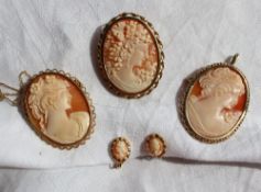 Three shell cameo brooches in yellow metal mounts,