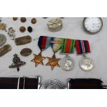 A set of four World War II medals including The 1939-1945 Star, The Atlantic Star,