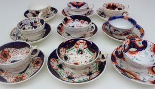 A collection of Gaudy Welsh tea cups and saucers,