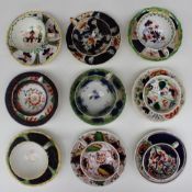 A collection of Gaudy welsh tea cups and saucers,