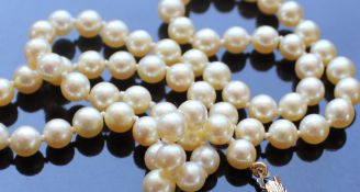 A pearl necklace, set with seventy regular individually knotted pearls to a 9ct gold clasp,