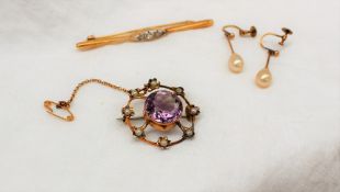 An amethyst and pearl brooch,