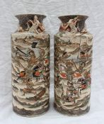 A pair of Japanese Satsuma pottery vases, of cylindrical form with a flared neck,