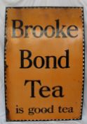 A large enamel sign "Brooke Bond Tea is good tea" with a chequer edge black script and Orange