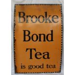 A large enamel sign "Brooke Bond Tea is good tea" with a chequer edge black script and Orange