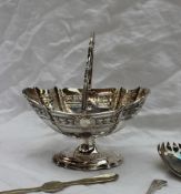 An Edward VII silver swing handled pedestal bowl,