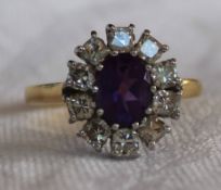 An amethyst and diamond ring,