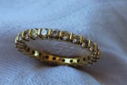 A diamond eternity ring, set with round brilliant cut diamonds each approximately 0.