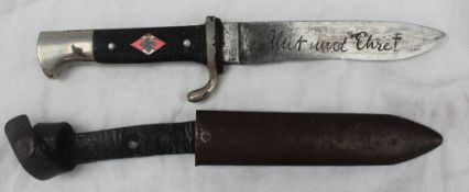 A Third Reich Hitler Youth dagger with enamelled insignia to chequered grip,