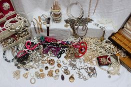 A large quantity of costume jewellery including necklaces, brooches, earrings,