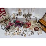 A large quantity of costume jewellery including necklaces, brooches, earrings,