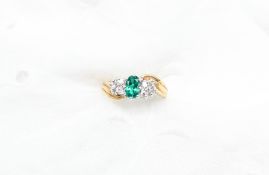 An Emerald and diamond ring,