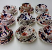 An assortment of Gaudy Welsh tea cups and saucers, various patterns including book,