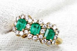 An emerald and diamond ring,