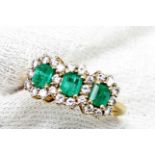 An emerald and diamond ring,