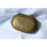 An American brass tobacco twist tin, of oval form, stamped "George Thomas, 2136 Brick Ave,