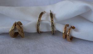 A pair of 9ct yellow gold twist earrings, together with two other pairs of yellow metal earrings,