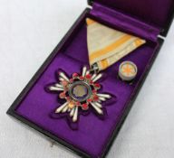 A Japanese military award "Order Of The Sacred Treasure",