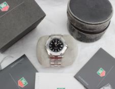 A Tag Heuer Mid size stainless steel professional 200m wristwatch, with a black dial,