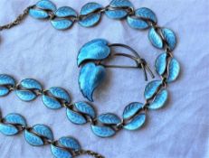 A David Anderson blue enamel and silver leaf necklace together with a matching brooch