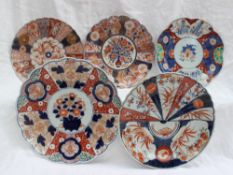 An Imari plate, decorated with bands of flowers, trellis etc, 21.