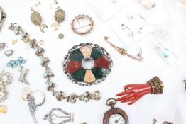 A Scottish hardstone brooch together with assorted costume jewellery including earrings, bracelets,