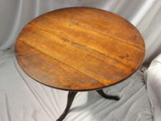 A 19th century oak tripod table,