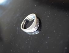 An 18ct white gold ring set with 9 round brilliant cut diamonds to a V shaped setting