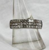 A diamond half eternity ring set with three rows of sixteen princess cut diamonds to an 18ct white